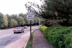 From the shopping center parking lot walk north on the east side of Burke Commons Rd.