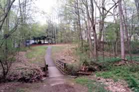 Turn right, cross the bridge and follow the trail up the hill.