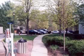 Turn right onto the sidewalk along Chase Commons Dr next to the apartment office.