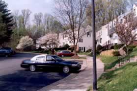 The trail intersects with First Landing Wy. Turn right to follow the sidewalk along the right side of that road.