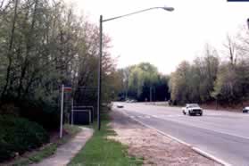 The wide trail ends at First Landing Wy. Follow the gravel shoulder along Burke Centre Pwy. The narrow trail on the left of the shoulder should not be used as it leaves this road shortly.