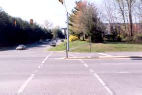 Cross Burke Centre Pwy on the west side where the walk light is located.