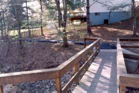 The trail turns sharply to the right to cross the stream. It then turns left to follow it.