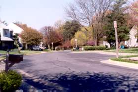 Turn left to follow the sidewalk along Beacon Pond Ln.