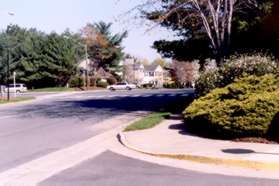 Turn right to follow the sidewalk to the end of Marshall Pond Rd.