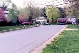 Cross the intersecting street (Wooden Hawk Ln) and turn right to follow the sidewalk on the other side.