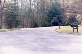 The path ends at a cul-de-sac.  Follow the sidewalk out to the main road.