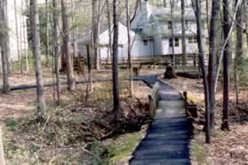 After crossing the bridge turn left a the next trail intersection.