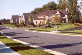 The path intersects with Stones Throw Dr.  Cross the street and turn left to continue on the asphalt trail.