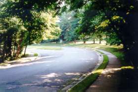 Cross Hunt Club Rd and follow the sidewalk on the other side to the right.