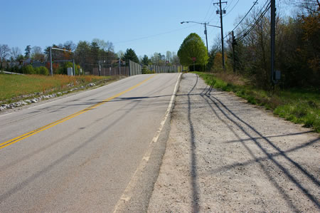 Turn right and walk along the shoulder of Hooes Rd.