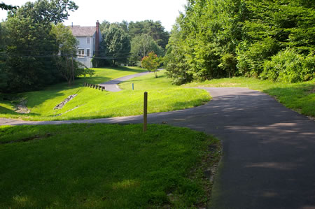 Turn left at the first asphalt trail .