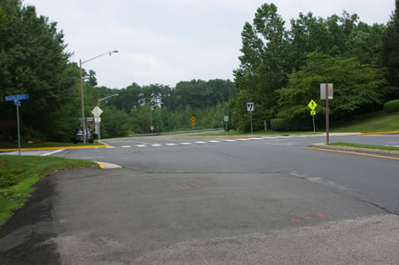 Cross Rockledge Ct. Turn right and cross Hunter Village Dr. in the crosswalk. Turn left and follow the sidewalk along Hunter Village Dr.