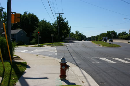 The trail crosses Sutton Rd. Oakton High School is on the left.