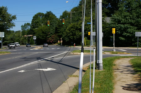 The trail crosses Sutton Rd. Oakton High School is on the right.