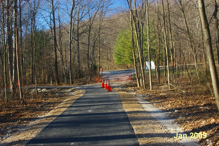 The trail reaches Hunter Village Dr. and turns left. This concludes this section of the trail.