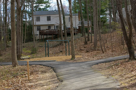 Turn right as the first intersecting asphalt trail and walk up the hill.