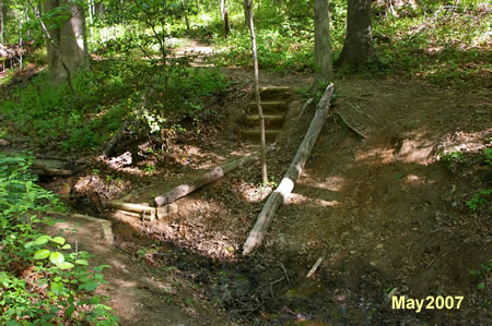 After crossing the gully climb the steps up the other side.