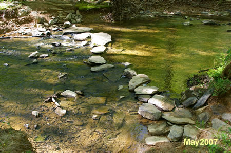 These rocks provide the crossing. There is one gap that may be difficult.