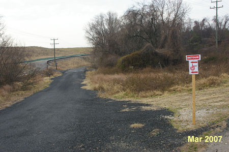 Follow the trail with the landfill on your left.