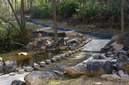 The trail crosses South Run on columns.