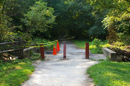 This crossing was damaged by the flooding in June 2006. It is passable.