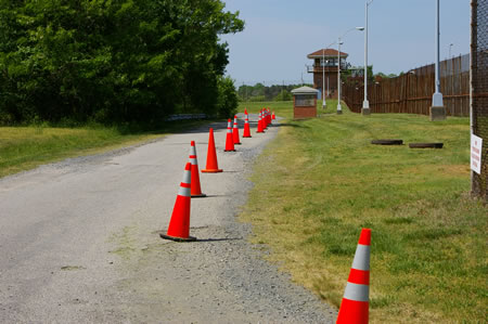 The perimeter road turns to follow another side of the baseball field.