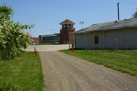 The hard surface trail ends at a parking area and watchtower. Turn right.