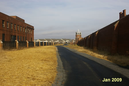 The trail follows a  wall on the right.