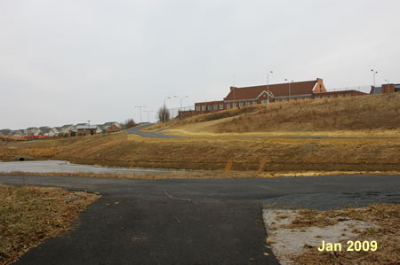 Turn right onto the asphalt trail at the retention basin.