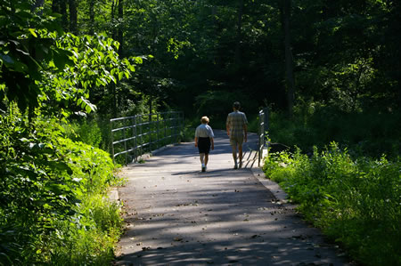 The trail crosses Accotink Creek on a bridge.