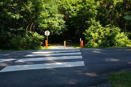 The trail crosses Barkely Dr. This road has lgiht traffic.