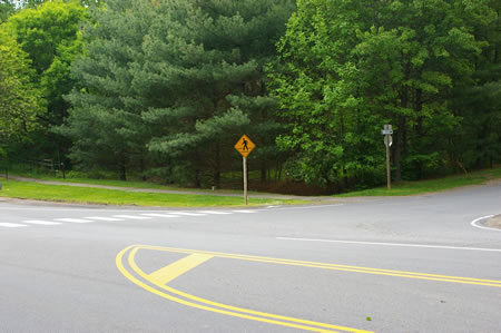 Use the marked crosswalk to cross Vale Road.