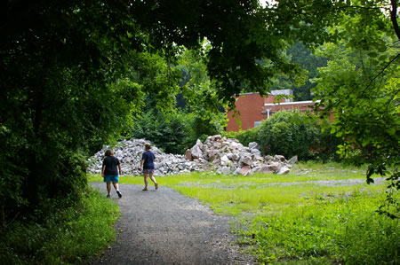 The trail turns left near a maintenance building.