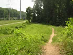 The trail crosses an earth dam.