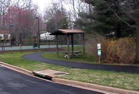 Take the path in the back of the parking lot going past the tennis courts.