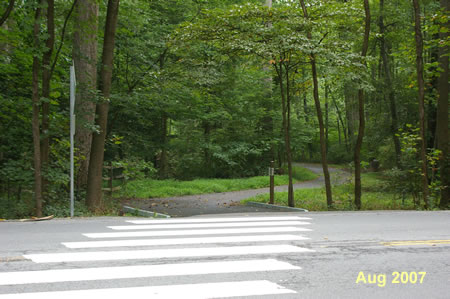 The long loop continues on the asphalt path and crosses Soapstone Dr.