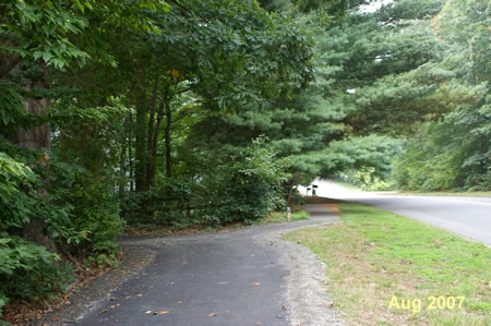 After Quartermaster Ln the trail splits.  The wide asphalt trail to the left is hilly.  The narrow trail to the right along Glade Dr is flat.  Take either route.