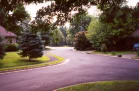 Follow the sidewalk after the circle on Gatesborough Ln.