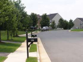 Turn right at Murray Downs Way to follow the sidewalk on the left side of that street.