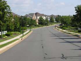 Turn right at the intersection with Gates Meadow Way and follow the sidewalk along the left side of that road.