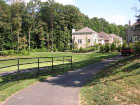 The trail turns to the right to loop around a water retention basin.