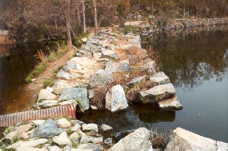 This picture shows how the pipe provided another outlet for the canal.  The rocky towpath continued.