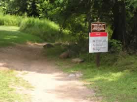 After returning to the main trail the next trail on the left goes to Fishermans Eddy. This trail is for use by kayakers only. Pay attention to the warning sign.