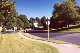 At the intersection with Heather Down Dr turn left and follow the sidewalk along that street.