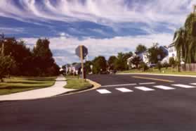 Turn left and follow the sidewalk on Kingstream Dr.