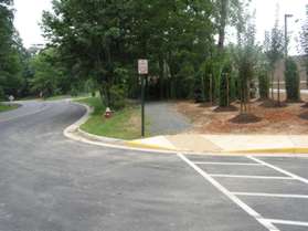 The trail turns and crosses the school driveway and follows Steeplechase Rd.