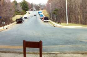 Take the concrete sidewalk to the right on Danbury Forest Dr.