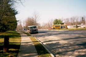 Take sidewalk west on N Shore Dr from Fairway Dr with Lake Anne school on right.