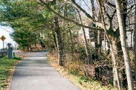 The trail crosses the dam.  Climb the hill and take the trail to the right.